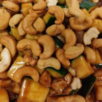 Cashew Chicken · Chicken stir-fried with zuchini, carrots, bamboo shoots and water chestnuts in brown sauce,t...