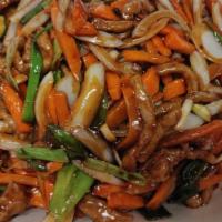 Mongolian Pork · Pork stir-fried  with green onions, white onions and carrots in Mongolian brown sauce.