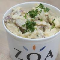 Egg Potato Salad · New potatoes, chopped egg, minced red onion, minced garlic, and parsley.