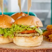 Fish Burger With Fries · Delicious Burger, topped with a golden Fish fillet, a slice of cheese, lettuce, onions, toma...
