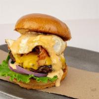 Dougie · Beef Patty with Cheddar Cheese, Lettuce, Bacon, Red Onion, Cage Free Fried Egg and Village S...