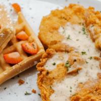 Chicken And Waffle · Fried chicken breast served with gravy and a cup of fruit.