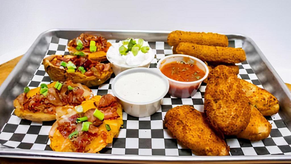 Appetizer Sampler · Stuffed jalapeños, fried cheese sticks, and potato skins. Served with sour cream and ranch.
