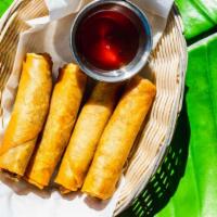 Crispy Spring Rolls · Carrot, cabbage, and noodles in Thai spring roll wrapper. Vegetable option is vegetarian.