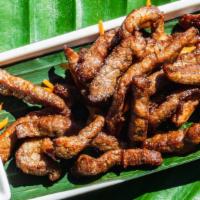 Thai Beef Jerky · Sliced fried beef marinated with Thai seasoning, served with flavorful dipping sauce.