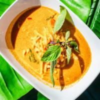 Red Curry · Spicy. Red chili, herbs, shrimp paste, bamboo shoots, basil, and bell pepper in coconut milk.