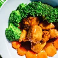 Orange Chicken · Boneless chicken breast and broccoli in Oriental style orange sauce.