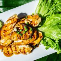 Teriyaki Chicken · Marinated grilled chicken breast or beef topped with teriyaki sauce and sesame seeds.