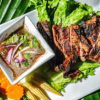 Crying Tiger · Grilled ribbed-eye steak marinated with special ingredients. So delicious the legend said ev...