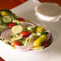 Garden Salad · Romaine Lettuce with Banana Peppers, Red Onion, Green Peppers, & Tomatoes. Served w/Parmesan...
