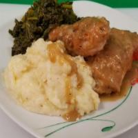 Smothered Chicken · Southern Plate with choice of dark bone-in or boneless breasts oven fried chicken cooked in ...