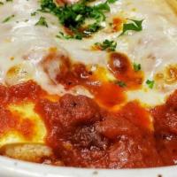 Manicotti. · ricotta and herbs rolled in pasta topped with marinara and cheese