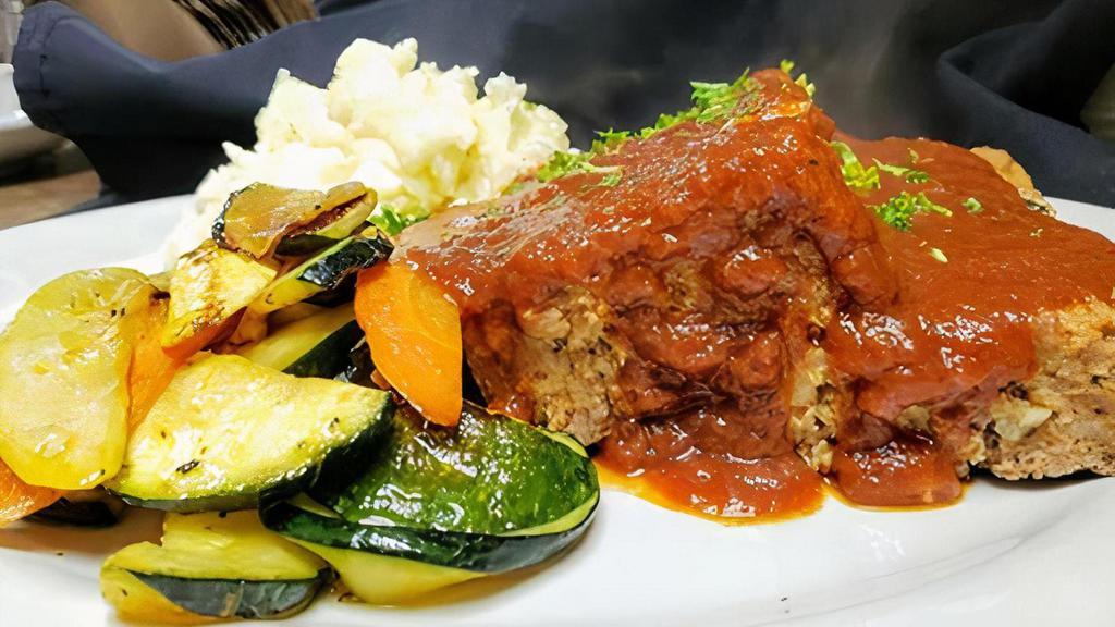 Homemade Italian Meatloaf. · pork, veal, and beef seasoned meatloaf . topped with savory tomato sauce