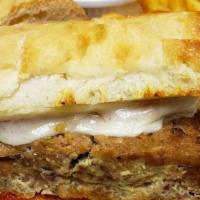 Meatloaf Sandwich · 3 meat meatloaf, savory tomato topping, french fries