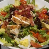 Cobb Salad · Gluten free. Crisp romaine, field greens, grilled chicken breast, avocado, tomato, bacon, bl...