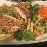 Asian Salad · Crisp romaine, shredded napa cabbage, carrots, snow peas, green onion, cilantro, edamame, pe...