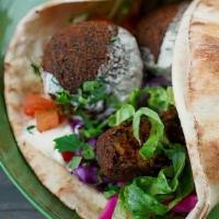 Falafel Pita · chickpea fritter, tahini sauce, mint red cabbage, tomato, pickled turnips, lettuce, parsley....