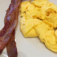 Two Eggs Any Style · Comes with your choice of applewood bacon, turkey bacon, sausage links, sausage patties, tur...