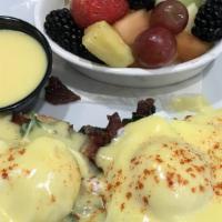 Florence Benedict · Poached eggs, chopped bacon, spinach, avocado, english muffin, and homemade hollandaise