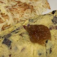 Fig And Bacon Omelet · California figs, scallions, applewood bacon and aged havarti cheese tossed with extra virgin...