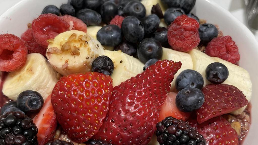 Acai Power Bowl · Acai pureed with fresh bananas, strawberries and blueberries. Served chilled and topped with granola and fresh fruit.