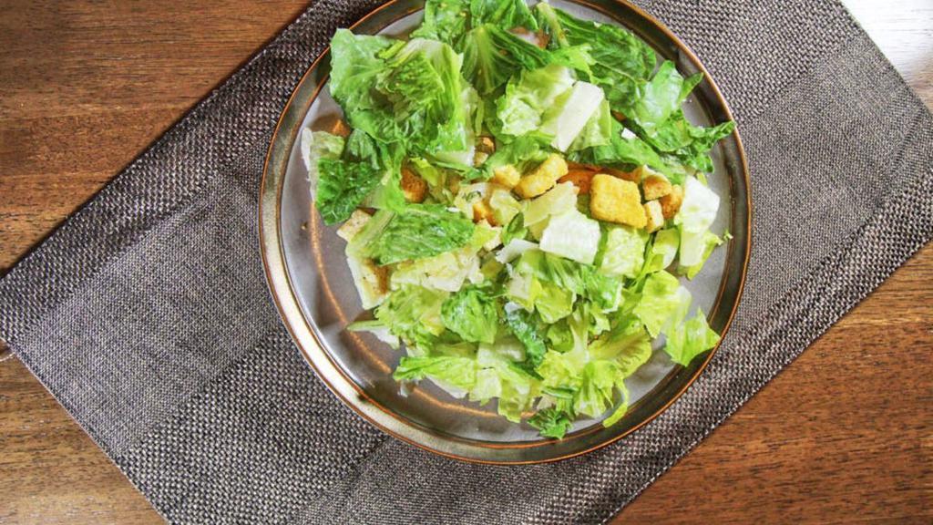 Caesar Salad · Romaine lettuce, Romano cheese, and creamy Caesar dressing.