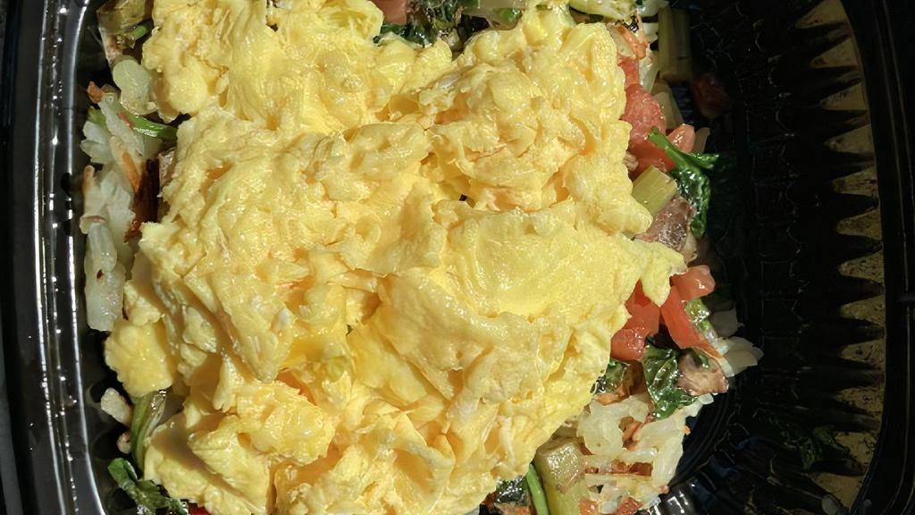 Veggie Skillet · Hashbrowns, cheddar and jack cheeses, two eggs, mushrooms, bell peppers, spinach, onion, tomatoes and broccoli