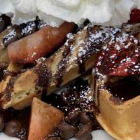 Strawberry Chocolate Waffle · Decadent cookies and cream waffles topped with crumbled Oreo cookies, whipped cream and choc...