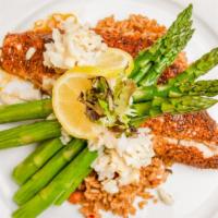 Oscar Style Red Snapper · Blackened red snapper served over dirty rice with asparagus spears, topped with lump crab an...