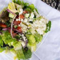 Greek Salad · Lettuce, Tomato, Cucumber, Onion, Feta Cheese, Black Olives,1 Dolma, Greek Vegan Dressing.