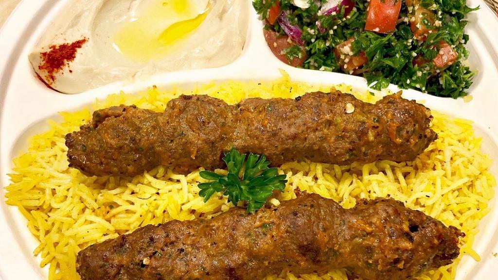 - Mediterranean Bbq Over Rice(Chicken Sh.Tawooq, Sheesk Kabab Or Lamb Mashawi · Grilled on open fire. Served with hummus, tabouleh, pita, and tomato sauce.