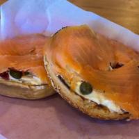 Salmon Lox · Smoked salmon and cream cheese served on a bagel with tomatoes, onions and capers.