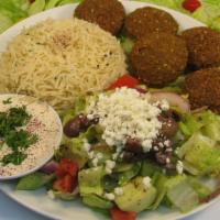 Falafel Over Rice · deep-fried chickpeas mixed with parsley,onions,cilantro & sesame seeds (6pcs) served with ri...