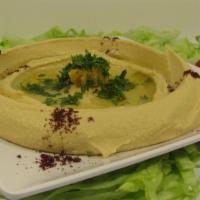 Hummus · chickpeas dip with sesame seed sauce topped with olive oil.