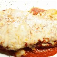 Eggplant Parmesan Stack · Lightly coated with Italian bread crumb, tomato sauce, mozzarella, spaghetti