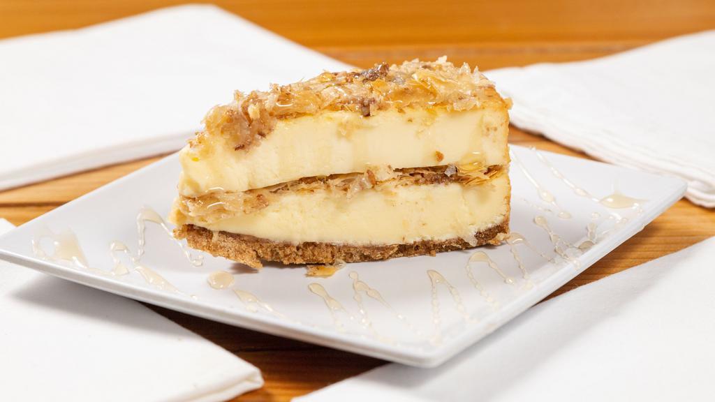 Baklava Cheesecake · Double layered cheesecake, stuffed with baklava, and topped with honey.