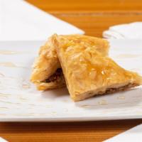 Baklava · Paper thin pastry, crushed smothered in homemade.