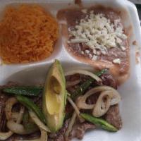 Plato De Fajita / Fajita Plate · This plate comes with homemade beans and rice tortillas cheese avocado and sauces of your ch...