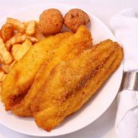 Catfish · 3 pieces of catfish with fries and hushpuppies.