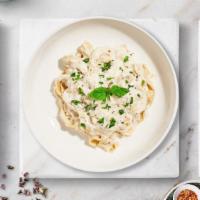 Chicken Fettucine Alfredo · Fresh fettuccine pasta served with chicken and a creamy alfredo sauce and your choice of top...