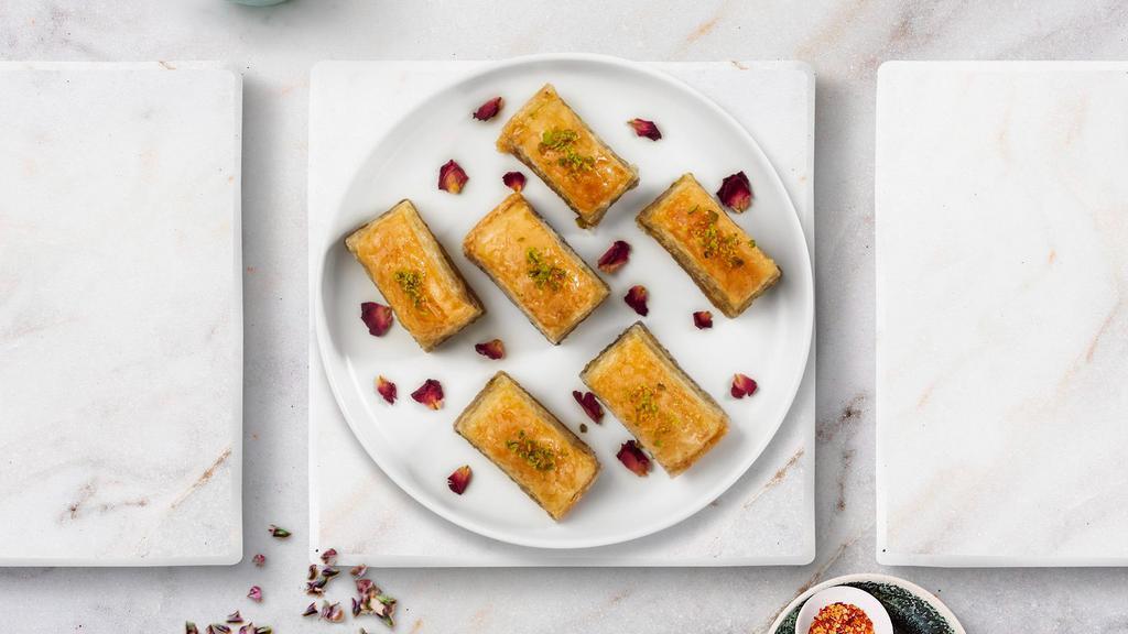 Baklava · (Two pieces) Phyllo dough and almonds or pistachio depending on availability.
