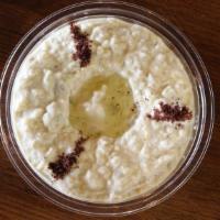 Baba Ghanoush · Vegan. Pureed eggplants mixed with tahini, lemon, garlic, topped with sumac and olive oil, s...