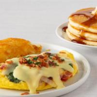 Fresh Spinach & Bacon Omelette · Fresh spinach, bacon and diced onions, topped with Swiss cheese and Hollandaise sauce.