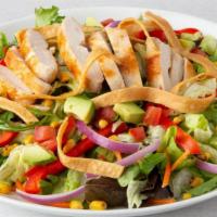 Southwest Salad · Grilled chicken breast, Southwest veggies, corn, avocado, tomatoes, and tortilla strips on m...
