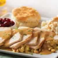 Slow Roasted Turkey · Hand-carved and served with cornbread stuffing, mashed potatoes and turkey gravy, cranberry ...