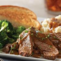 Pot Roast · Sliced tender pot roast topped with brown gravy and served with Texas toast. Served with cho...