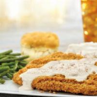 Chicken-Fried Steak · Smothered in country gravy and served with a buttermilk biscuit. Served with choice of two s...