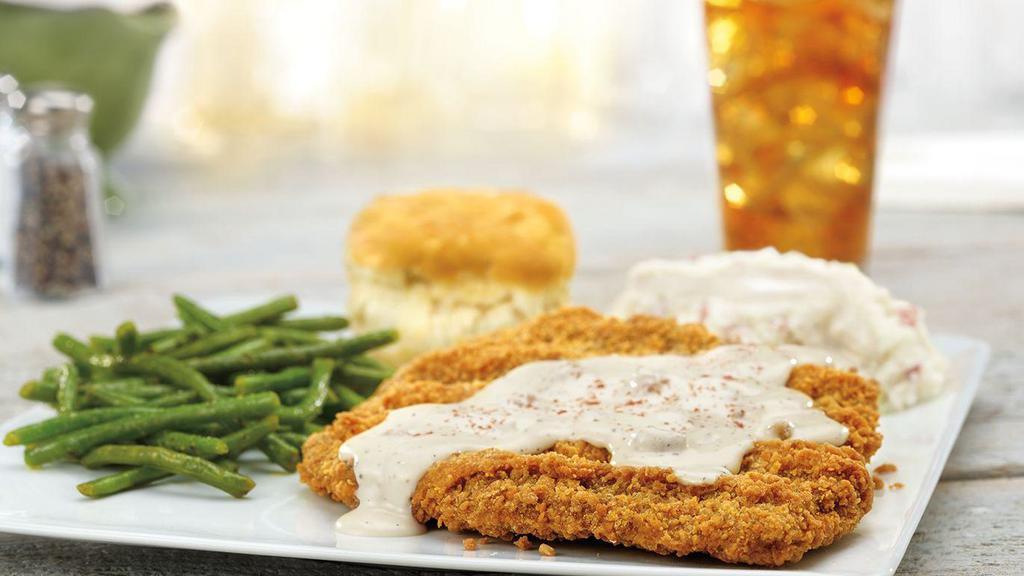 Chicken-Fried Steak · Smothered in country gravy and served with a buttermilk biscuit. Served with choice of two sides.