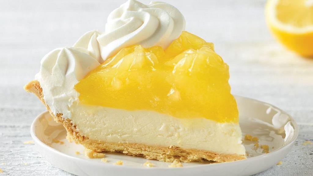 Lemon Supreme Pie Slice · Tangy lemon filling over cool, creamy supreme filling inside our flaky, golden pie crust, then topped with real whipped cream.