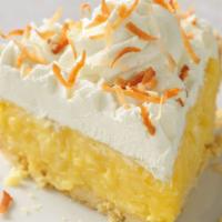 Coconut Cream Pie Slice · A buttery vanilla cream filling blended with shredded coconut then topped with real whipped ...